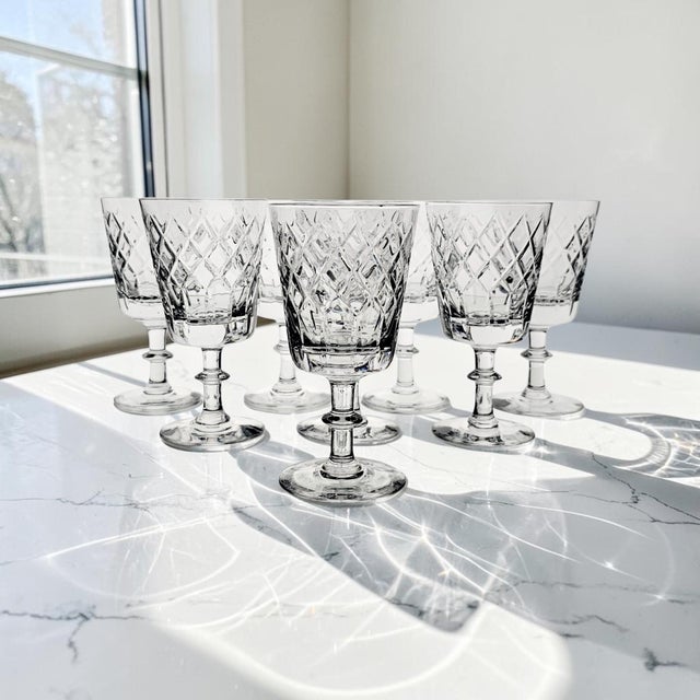 A distinguished set of eight Webb Corbett full lead crystal water goblets in the discontinued WEC2 pattern, produced in...