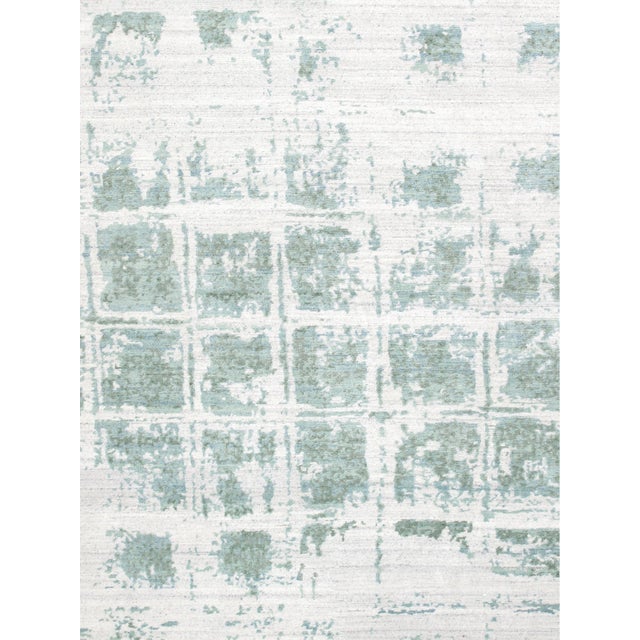 The Modern Collection explores hand-knotted designs through abstract patterning, solid tonal fields, and subtle surface...
