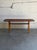Beautiful vintage Danish Mid-Century Modern teak coffee table featuring softly rounded corners, elegant minimalist lines,...