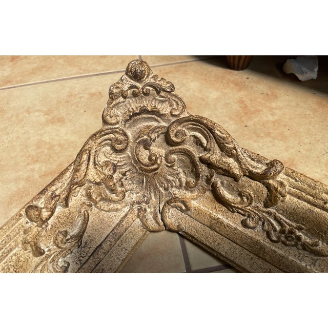 A decorative wooden frame featuring rich ornamentation in the Late Baroque and Rococo styles. It is distinguished by...