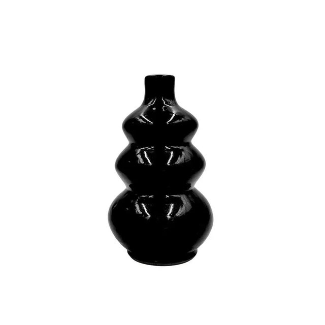 The rich and soothing shade of this vase adds a touch of freshness to your space. The painted finish gives a delicate...