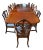 Substantial antique English mahogany dining suite comprising an expandable pedestal table and fourteen coordinating...