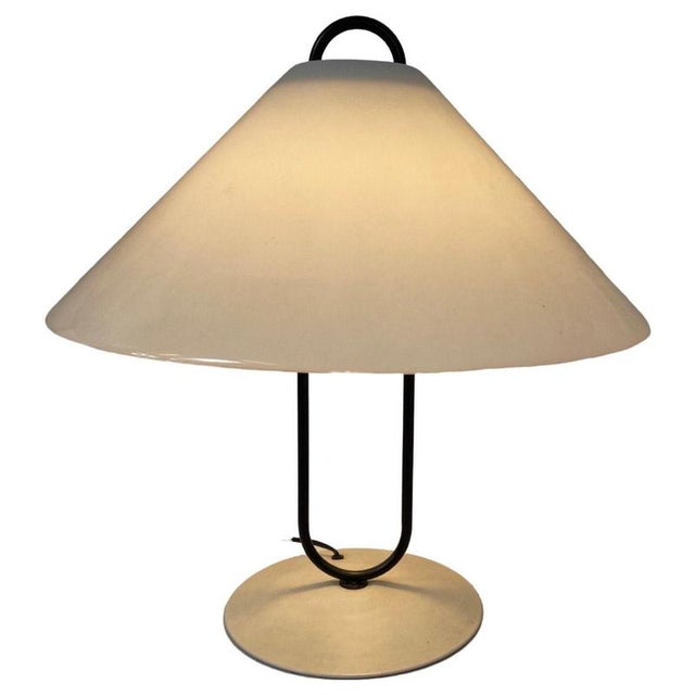 This piece has a metal base with black upright supporting the white acrylic glass shade. In good condition with only minor...