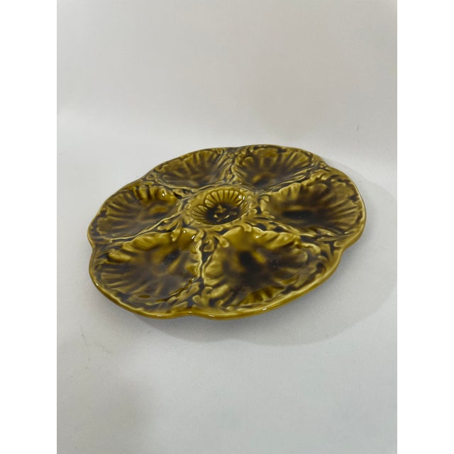 A striking glazed earthenware French Majolica (or barbotine) Oyster Plate crafted by the famous Gien workshop in France....