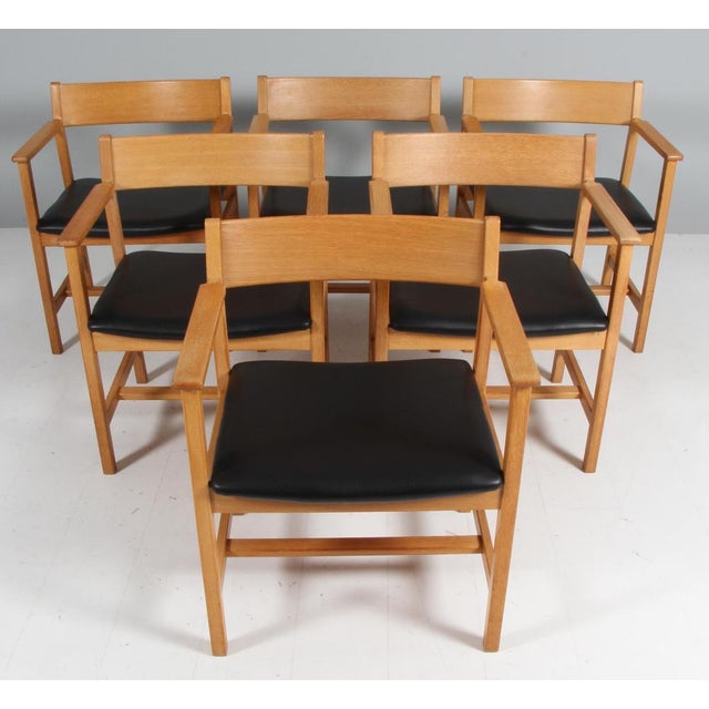 Børge Mogensen armchair made in partly solid oak. New upholstered with black aniline leather. Made by Fredericia...