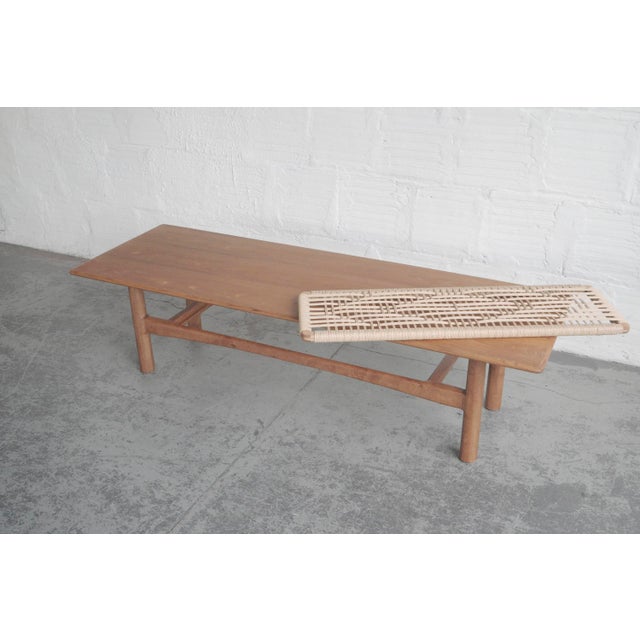 Vintage tabletop, base made in-house at The Good Mod in Portland, OR. Removable woven shelf.