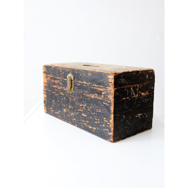 Early 20th century primitive ballot box with a richly worn black-painted finish and beautifully aged surface. Its simple,...