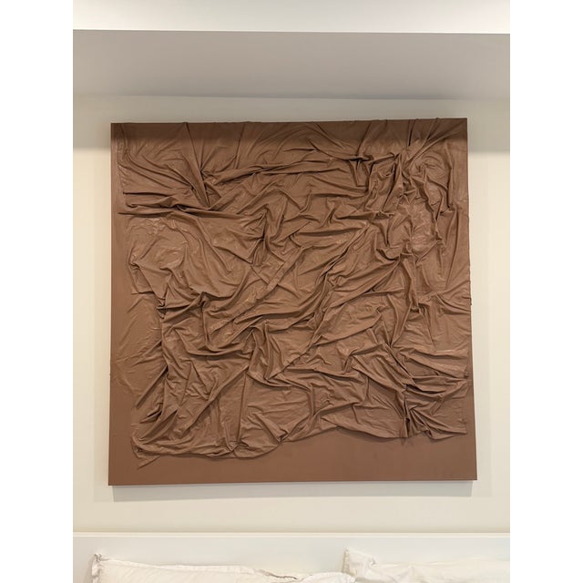 This one-of-a-kind piece explores movement, tension, and form through draped fabric, transformed into a sculptural wall...