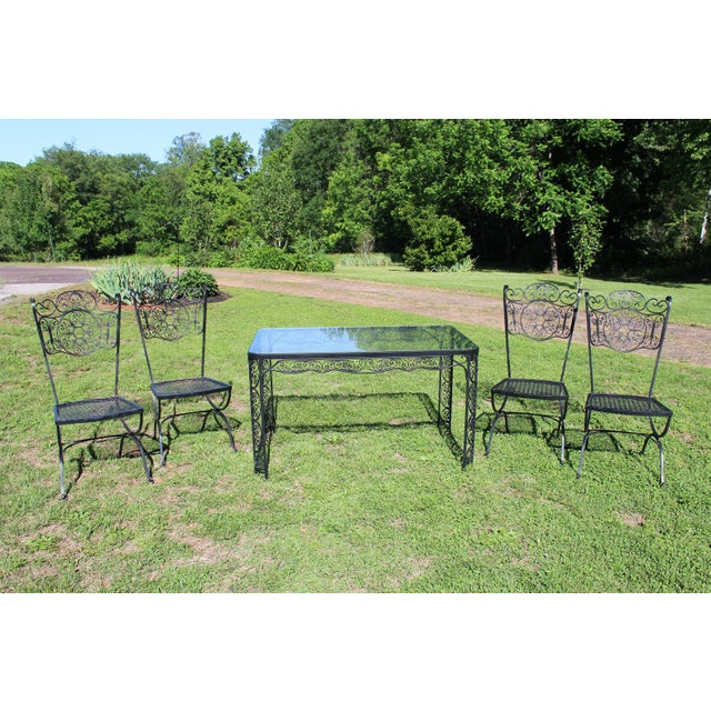 The Andalusian Collection by Lee L. Woodard & Sons features an abundance of fanciful scrollwork on the apron and legs of...