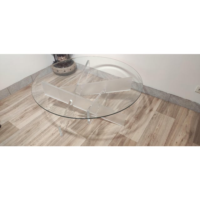 Designer coffee table in 8mm thick tempered glass with polished and beveled edges. 100cm diameter top on a 40cm high...