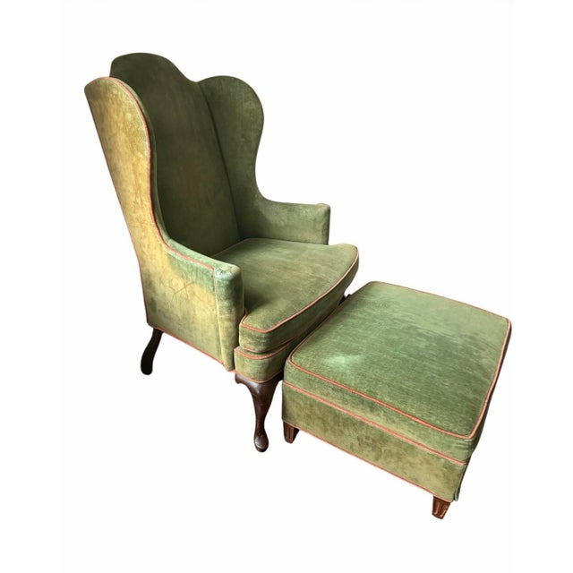 Woodmark Originals wingback chair and ottoman set. The chair and ottoman are covered in original green velvet which has...