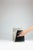In Svelate Assenze, matter and reflection meet along a precise line of intersection. Fior di Bosco marble embraces the...