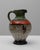 This 20th-century German ceramic pitcher is a stunning example of mid-century artistry, blending vibrant colors and...
