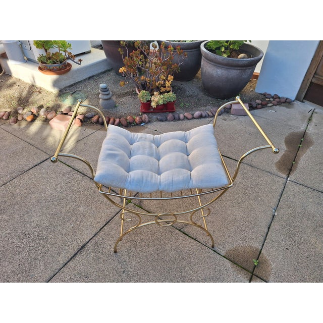 This Vanity Bench/Chair has amazing design elements. It is in the Hollywood Regent style/1950's 1960's. The Heavy metal is...