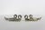Charming set of four silver plated swan knife or chopstick rests. Some tarnish and possible small spots of corrosion