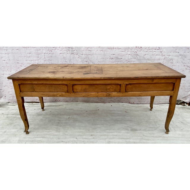 Stunning French Provincial Farmhouse Table. Table is crafted in solid walnut and its generous scale embodies the...