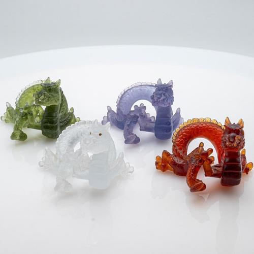 Luxury at its finest, high-end glass dragons with brown, violet, clear and green glass by Daum, France. The dragons are...
