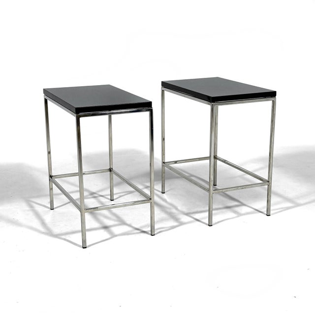 These sleek, small side tables have slender chrome bases that support tops of thick, charcoal colored granite. 20"h X 11"w...