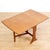This mid-century drop leaf dining table was produced by G Plan in England during the 1960s. Made from teak with two...