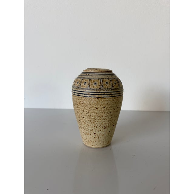 A charming vintage studio pottery vase. Handcrafted in ceramic with an organic tapered form and an incised artist...