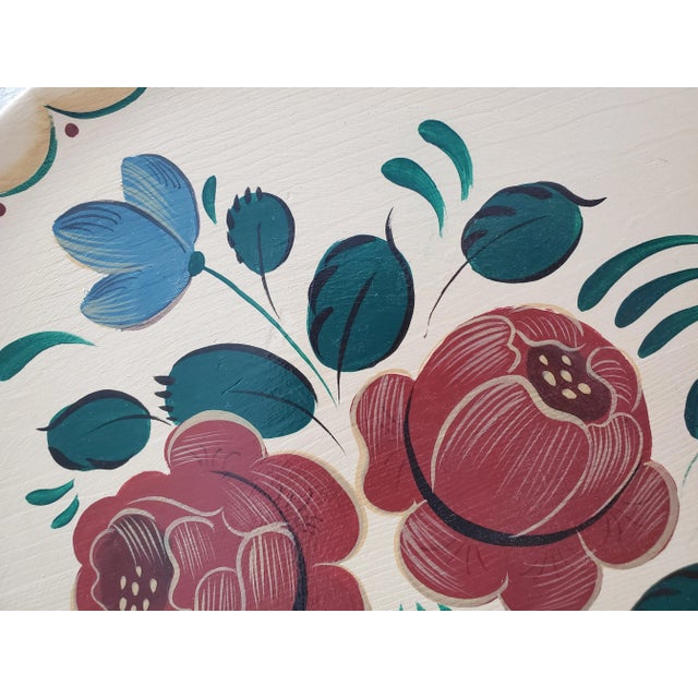 Lovely vintage handpainted wall plate in the classic floral tole style. Cream background with deep crimson roses framed by...