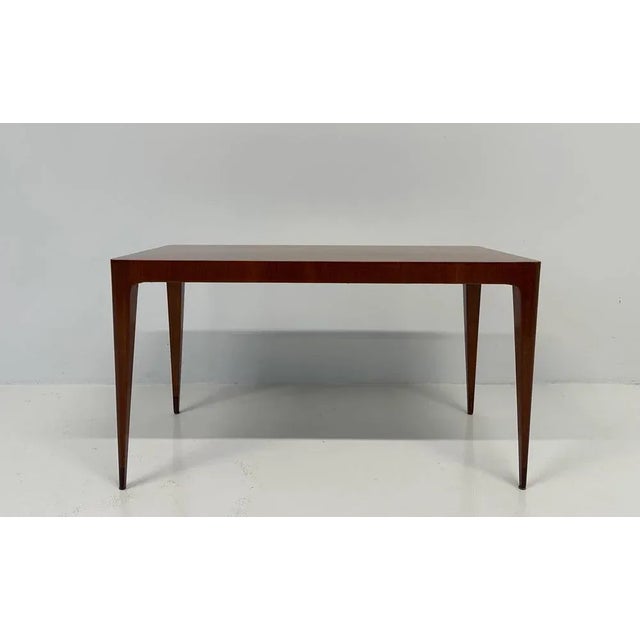 This Art Deco coffee table was produced in Italy in the 1950s by Paolo Buffa. It is completely made of Teak wood, with a...