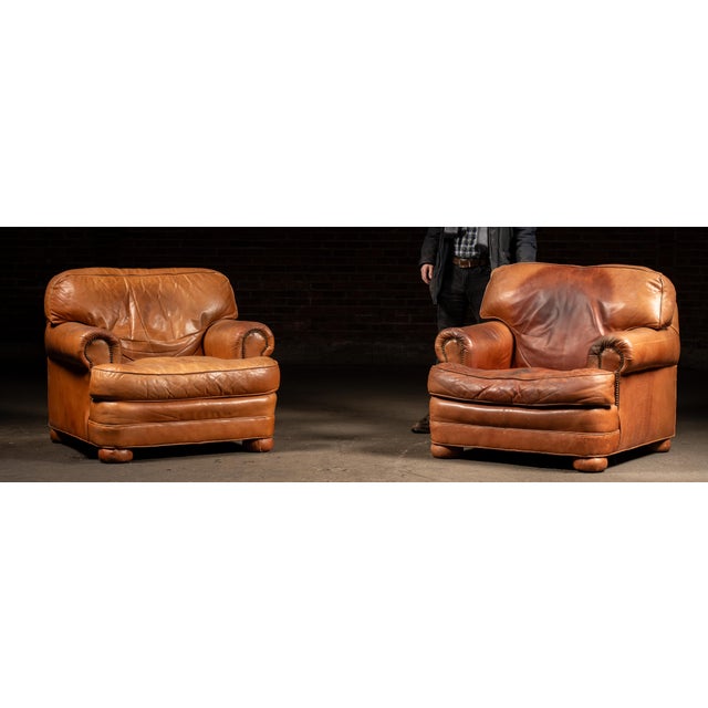 c. 1980s-1990s; Emerson Leather - Hickory, NC Matching pair of generously proportioned leather club chairs accompanied by...
