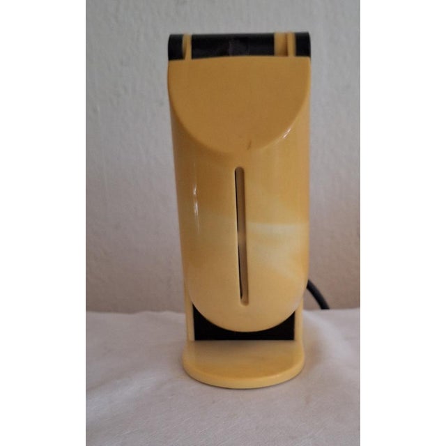 Vintage German Table Lamp in Yellowed Plastic by Brilliant, 1970s, in Good conditions. Designed 1970 to 1979 This piece...