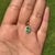 This dainty pendant showcases a 0.65 carat of natural emerald set in 14K yellow gold. The emerald measuring 6.8 x 4.7 mm,...