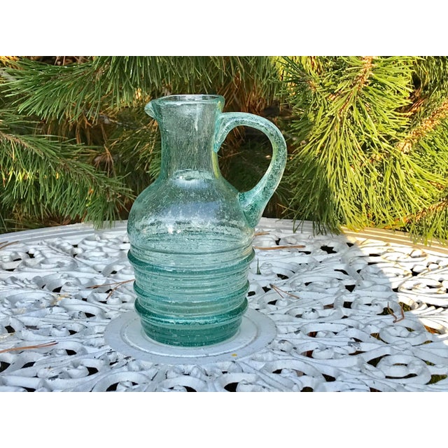 Antique hand blown and pulled green glass ewer. Finely etched a Viking ship to front.