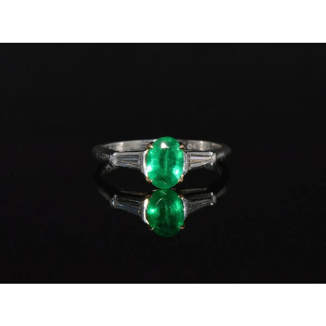 Gorgeous estate solid platinum 18K Gold 1.13CTS diamond emerald ring. This ring is studded with a large oval cut natural...