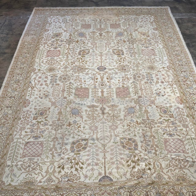 An exceptional antique Turkish Barlou rug, handwoven circa 1900, featuring a refined all-over floral and vine design in a...