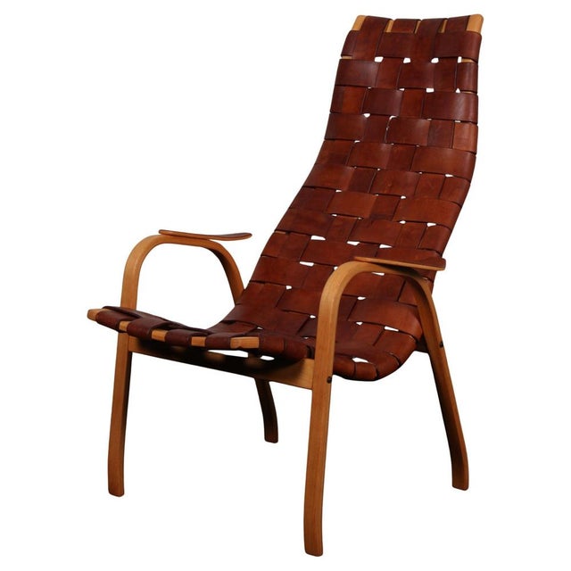 Yngve Ekström lounge chair with frame of beech and teak. Original patinated full grain aniline butt hide leather straps....