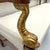 The beautifully carved and gilt dolphins on each arm of this elegant early 19th century bench make it unique. Typical of...