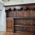 This English Oak Paneled 5 Door & 3 Drawer Dresser and Rack With Shaped Frieze is a great accent and storage piece for a...
