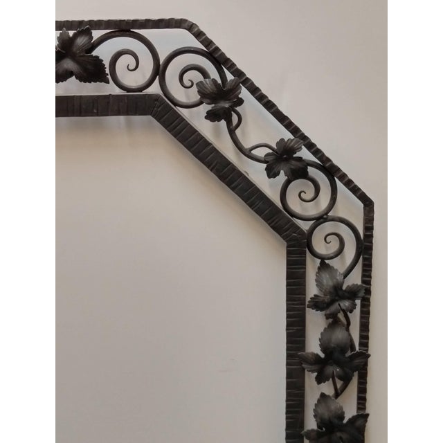 French Art Deco wrought iron mirror frame with hand-forged grapevine details. The frame will be accommodated with a...