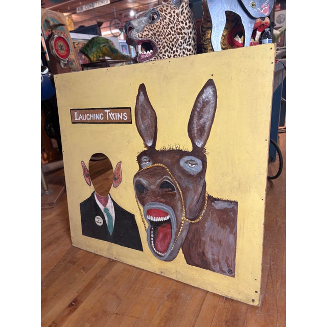 This vintage carnival photo-op board is a rare, hand painted survivor of mid-century roadside show culture and classic...