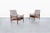 Pair of mid-century modern reclining high-back lounge chairs crafted in the United States during the 1960s, blending...