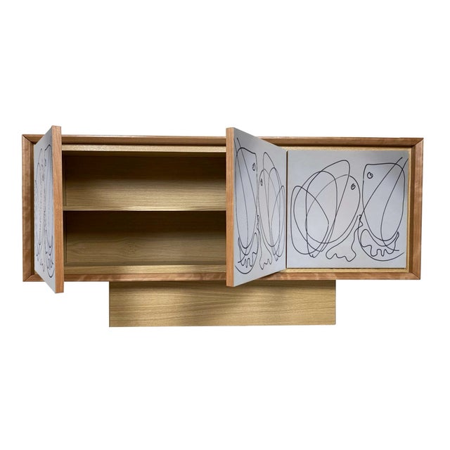 "Artistica Uno" sideboard, 2026, by Meccani Studio for Meccani Design. A beautiful oak sideboard with cherry and walnut...