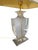 An elegant vintage table lamp from the 1970s in the Hollywood Regency style. The urn-shaped lamp body is made of high-...