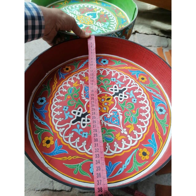 Moroccan Artisanal Table, Round Wooden Table. Three colors: red, green and blue The art of wood decoration, or what is...