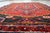 A vibrant handmade vintage Persian Hamadan rug from the 1930s, featuring a bold and lively geometric design centered...