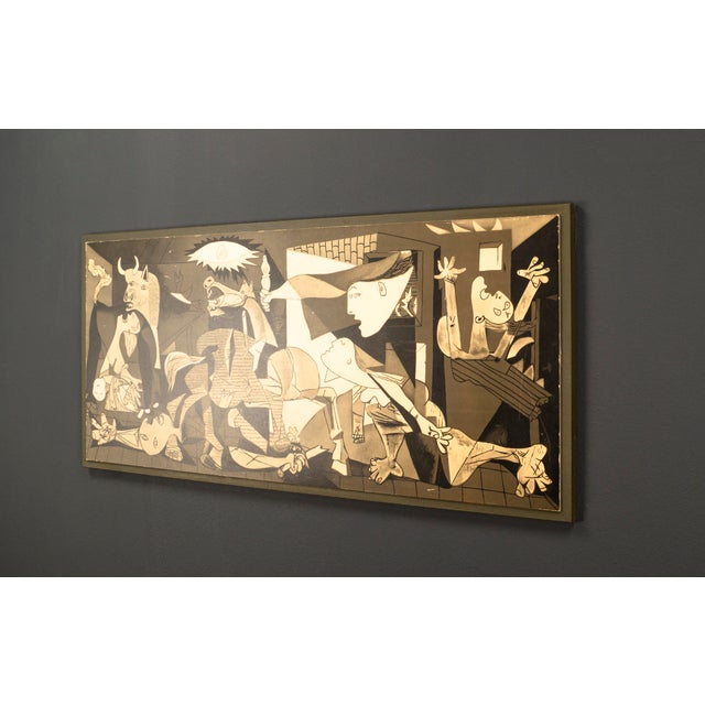 Printmaking Pablo Picasso's Guernica as a monochrome vintage reproduction from the second half of the 20th century.