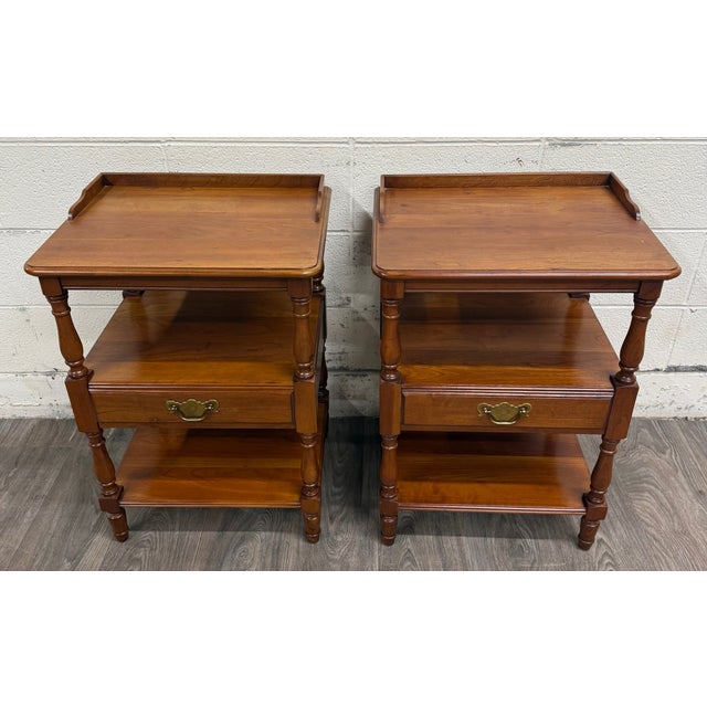 This is a beautiful pair of vintage Pennsylvania House hard rock maple Colonial style nightstands featuring gallery tops,...