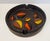 Offered for sale is a brown ceramic Bitossi ashtray or catchall accented with orange, yellow, brown and blacks leaves on a...