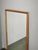 An elegant Danish Modern rectangular oak wall mirror, Model No. 146, by Aksel Kjersgaard of Odder, Denmark. Characterized...