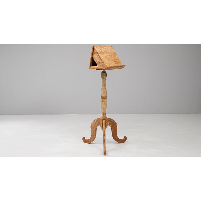 This 19th-century French wooden book stand showcases remarkable craftsmanship with a beautifully aged patina that enhances...