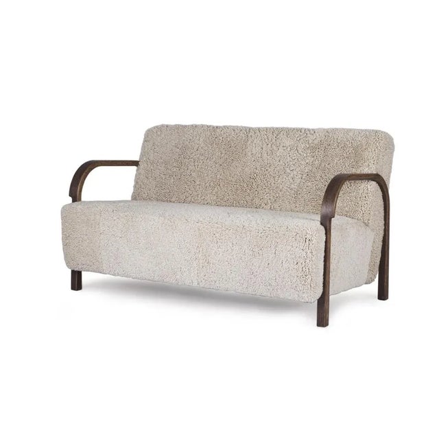 Moonlight sheepskin arch 2 seater sofa by mazo design dimensions: w 128 x d 79 x h 76 cm materials: oak, sheepskin also...