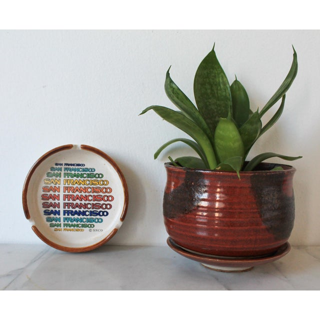 This vintage San Francisco SNCO ceramic ashtray from the 1970's features rainbow lettering and is designed for home use....