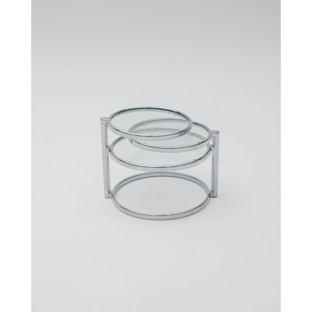 The Milo Baughman rotating coffee table is an iconic piece of Mid-Century design and 1970s aesthetics, celebrated for its...